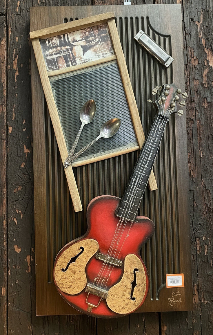 A red hollow-body electric guitar with a corkscrew headstock is displayed on a dark wooden wall-mounted shelf, alongside a vintage-style wooden washboard, two silver spoons, and a harmonica. The setting appears to be a retail display or boutique interior.